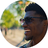 Smiling man wearing sunglasses outdoors